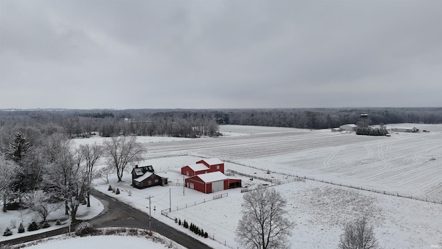 snowy aerial view featuring a rural view