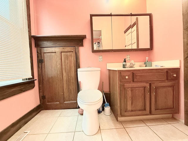 bathroom with tile patterned floors, vanity, and toilet