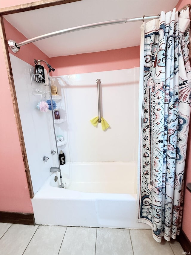 bathroom with tile patterned flooring and shower / tub combo