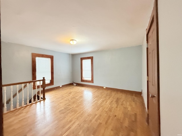 unfurnished room with light hardwood / wood-style flooring