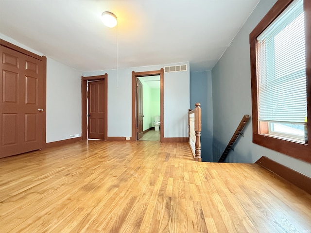 spare room with light hardwood / wood-style flooring