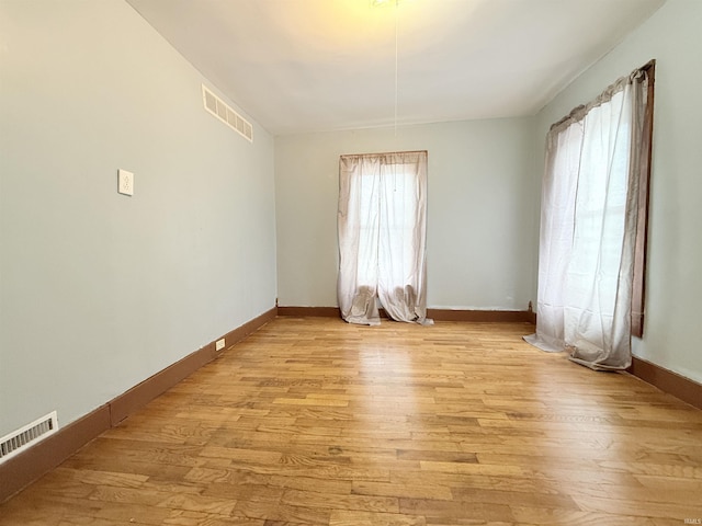 unfurnished room featuring light wood-type flooring