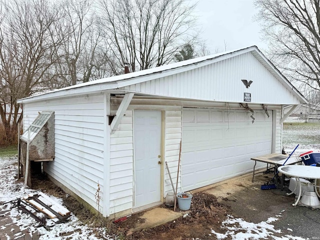 view of snow covered garage