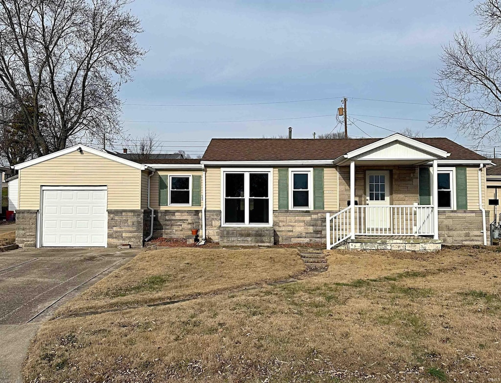 view of front of home featuring a garage and a front lawn