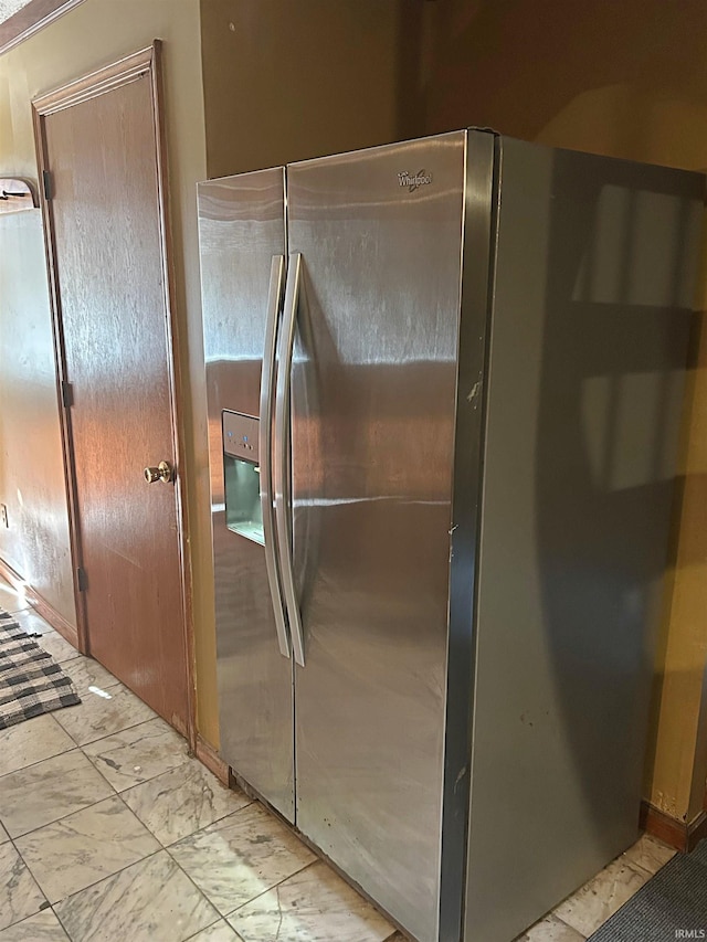 kitchen with stainless steel fridge with ice dispenser