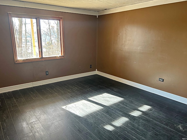 unfurnished room featuring a textured ceiling, crown molding, and dark hardwood / wood-style floors