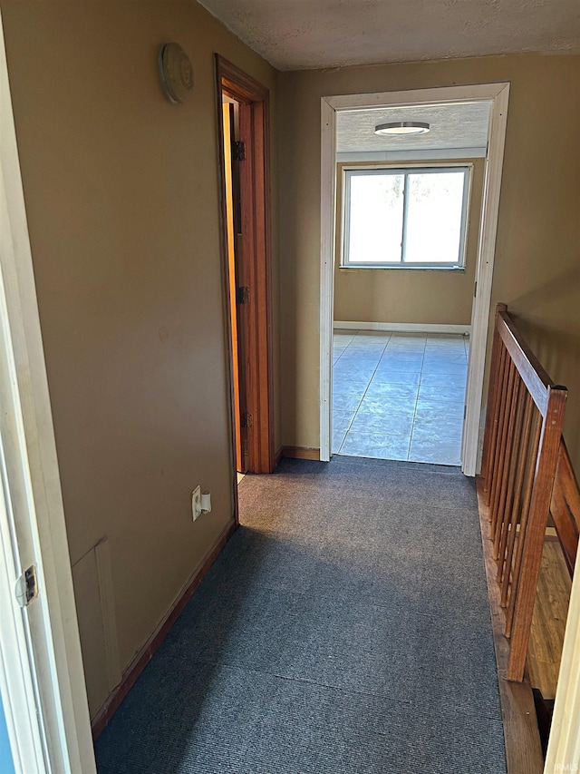 hall with carpet floors