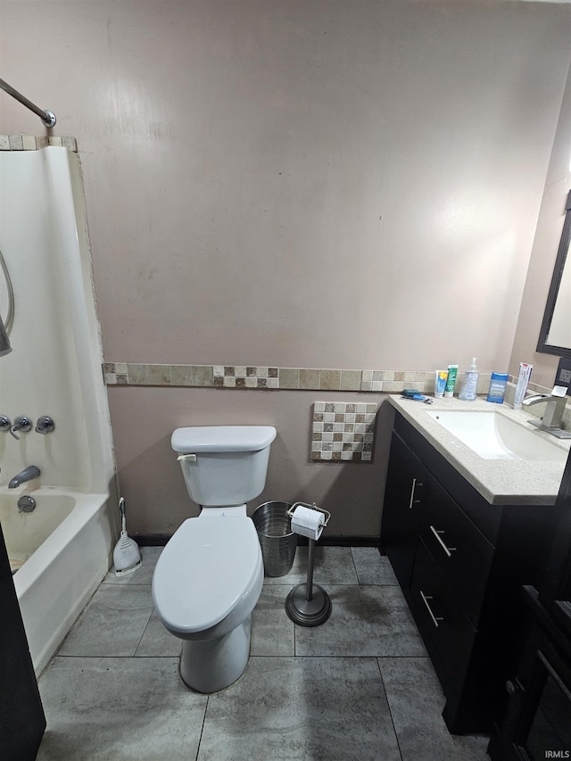 full bathroom featuring tile patterned floors, toilet, shower / tub combination, vanity, and tile walls