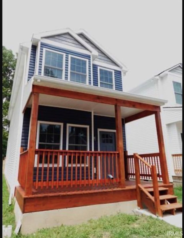 back of house with a porch