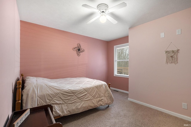 bedroom with light carpet, a textured ceiling, and ceiling fan