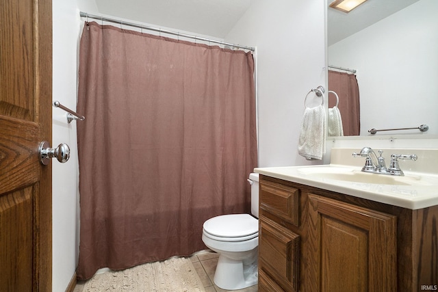 full bathroom featuring tile patterned floors, vanity, toilet, and shower / bath combo with shower curtain