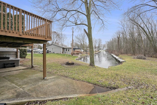 view of yard featuring a deck with water view