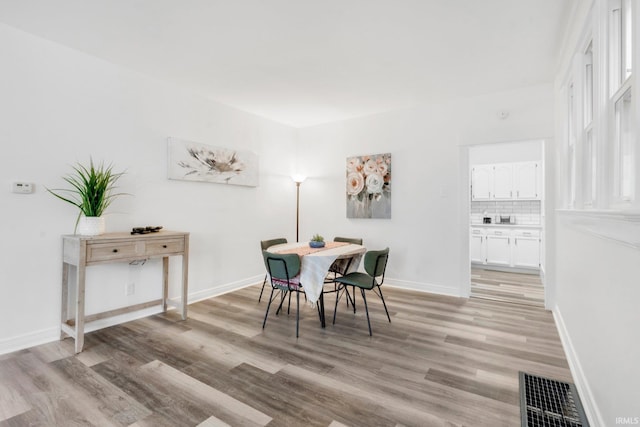 dining room featuring light hardwood / wood-style floors