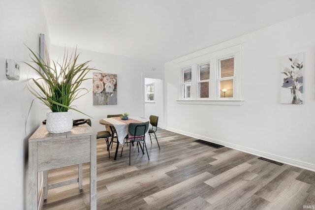 dining area with hardwood / wood-style floors