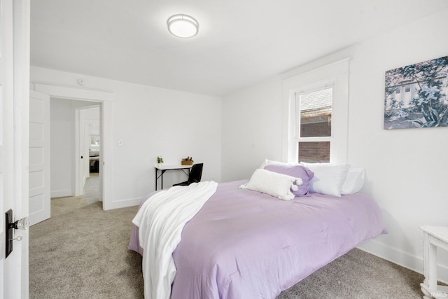 bedroom featuring light colored carpet