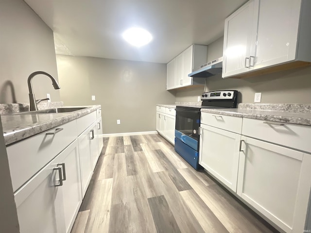 kitchen with white cabinetry, sink, black range with electric cooktop, light stone counters, and exhaust hood