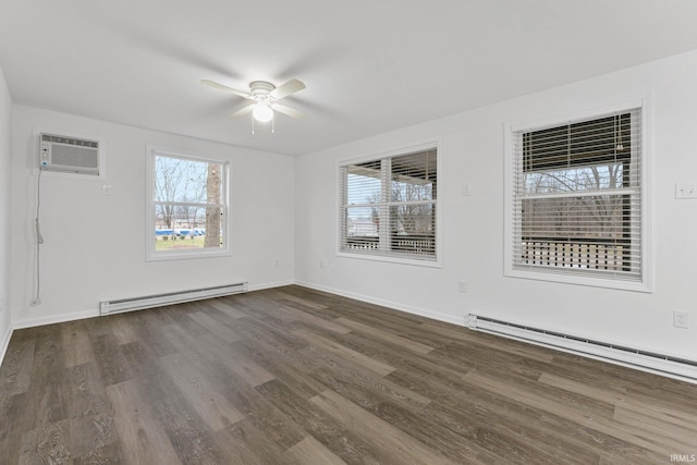 unfurnished room with a healthy amount of sunlight, dark hardwood / wood-style floors, and a baseboard heating unit