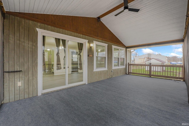 unfurnished sunroom with lofted ceiling with beams and ceiling fan