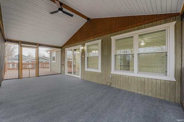 unfurnished sunroom with vaulted ceiling and ceiling fan