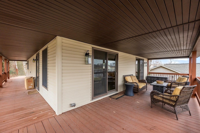 deck with an outdoor hangout area