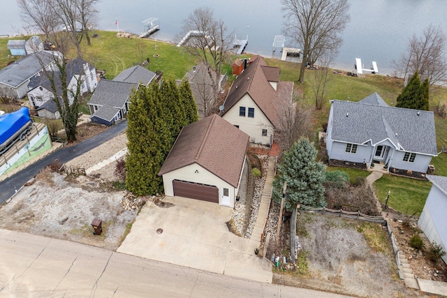 birds eye view of property with a water view