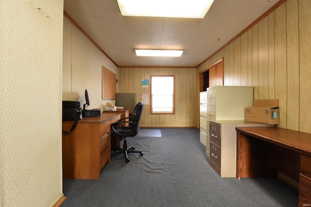 carpeted office with wooden walls and crown molding