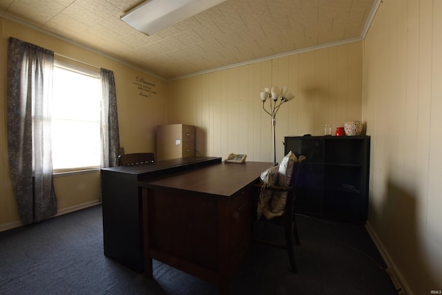 office featuring dark colored carpet, ornamental molding, and wood walls