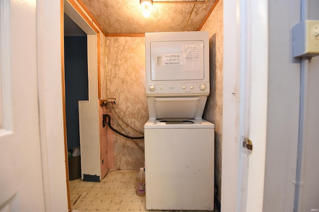 washroom with stacked washer and clothes dryer