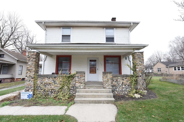 view of front of home with a porch and a front lawn