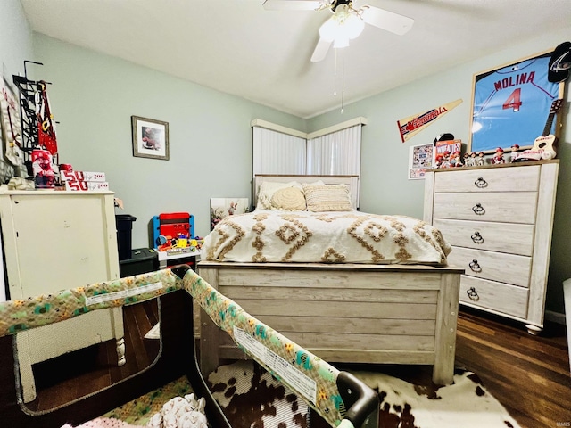 bedroom with ceiling fan and dark wood-type flooring