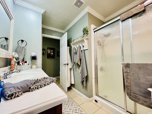 bathroom featuring vanity, tile patterned floors, a shower with shower door, and crown molding