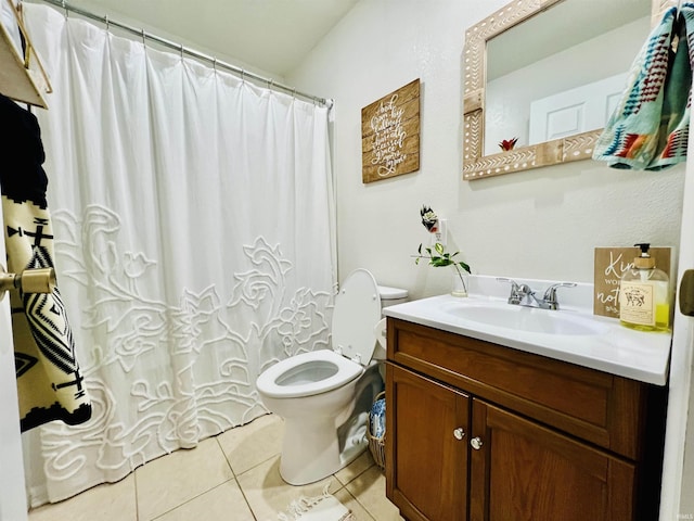 bathroom with tile patterned floors, walk in shower, vanity, and toilet