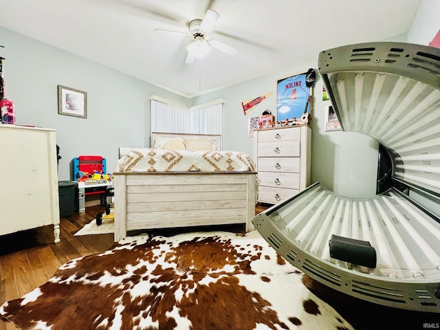 bedroom featuring hardwood / wood-style flooring and ceiling fan