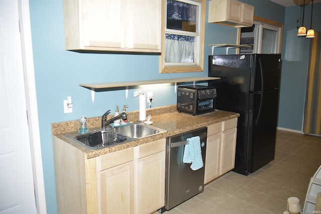 kitchen with light brown cabinets, sink, stainless steel dishwasher, pendant lighting, and black refrigerator