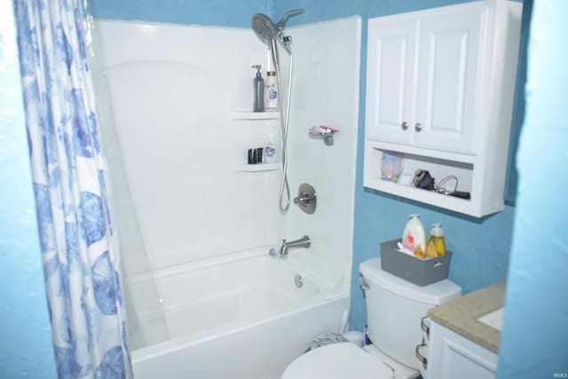 full bathroom featuring shower / bath combo, vanity, and toilet