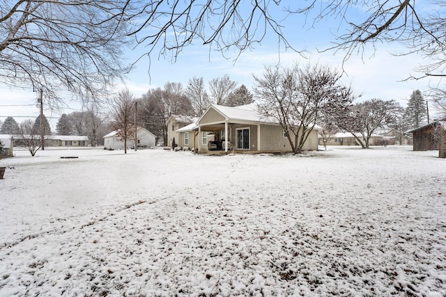 view of yard covered in snow