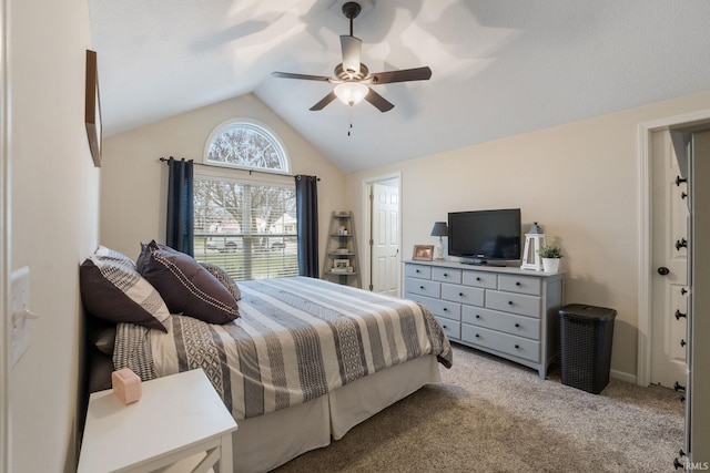 bedroom with ceiling fan, light colored carpet, and vaulted ceiling