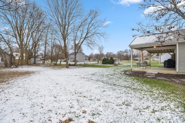 view of yard covered in snow