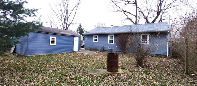 rear view of house with an outbuilding