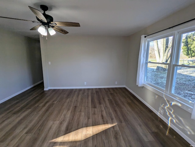 unfurnished room featuring ceiling fan and dark hardwood / wood-style flooring