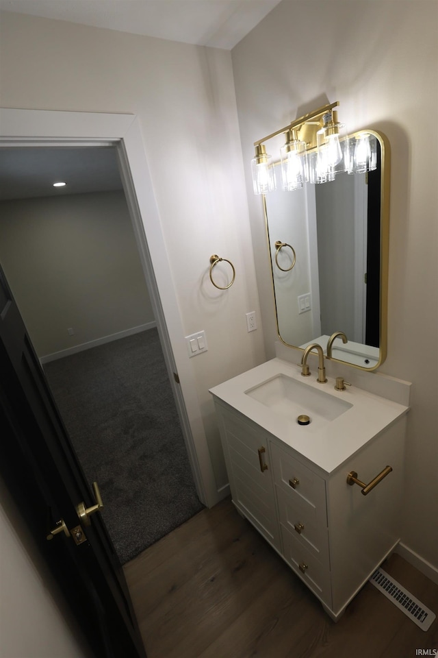 bathroom featuring hardwood / wood-style floors and vanity