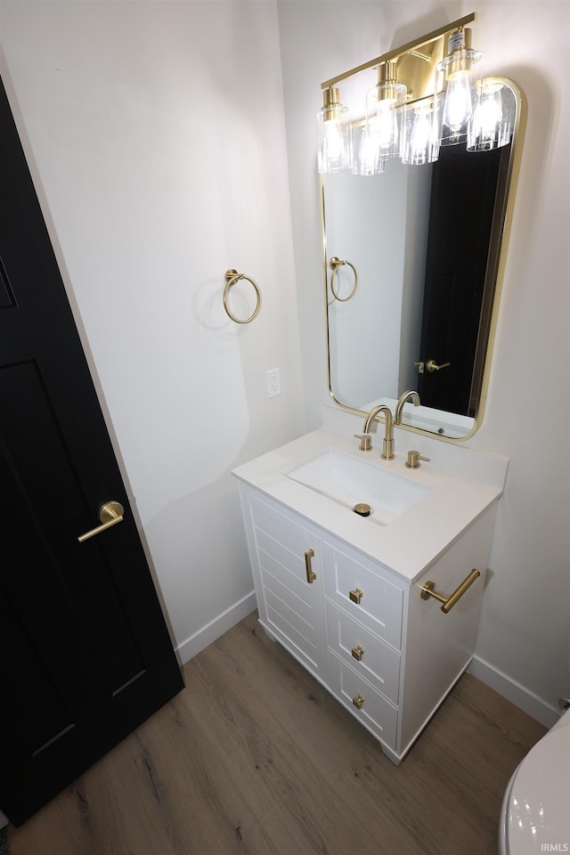 bathroom with vanity and wood-type flooring