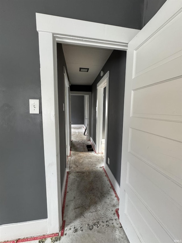 corridor featuring concrete flooring