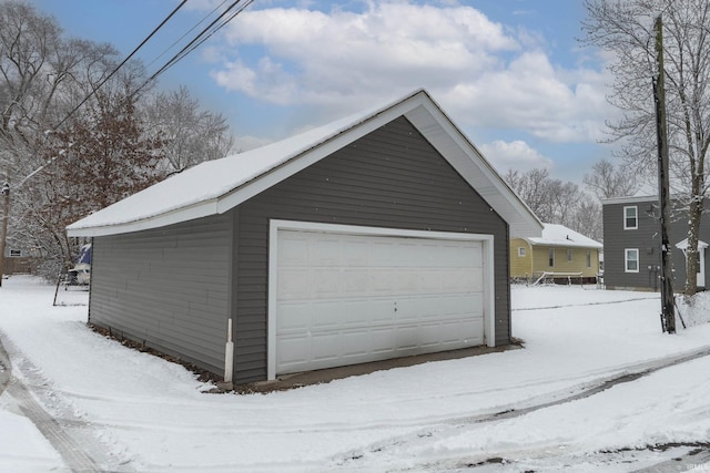 view of snow covered garage