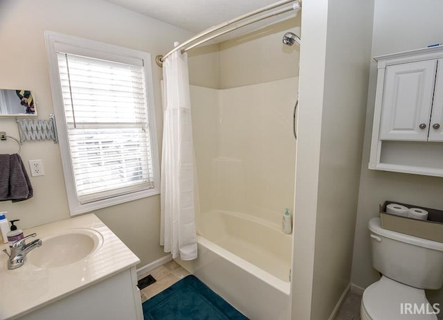 full bathroom featuring tile patterned floors, shower / tub combo with curtain, vanity, and toilet