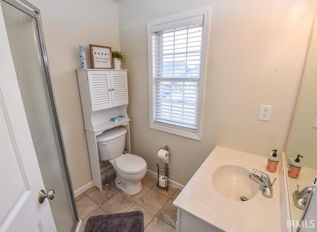 bathroom featuring tile patterned floors, vanity, an enclosed shower, and toilet