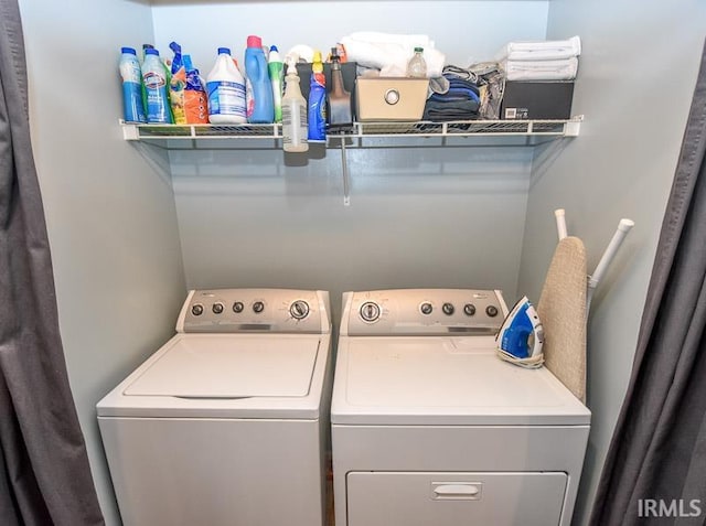 laundry area featuring washing machine and clothes dryer