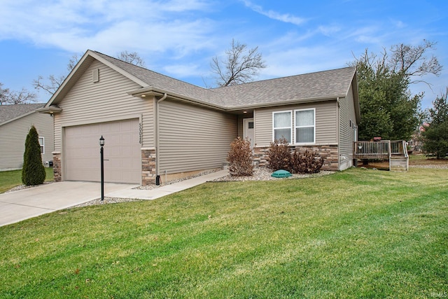 ranch-style home featuring a front yard, a garage, and a deck