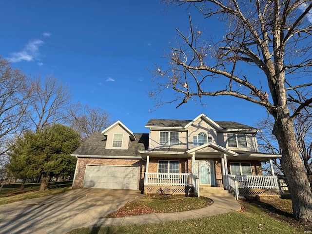 view of front facade featuring a garage and covered porch