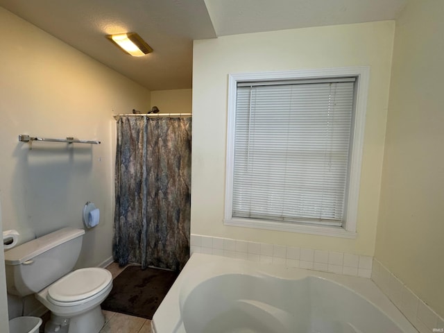 bathroom featuring toilet, tile patterned flooring, and a washtub